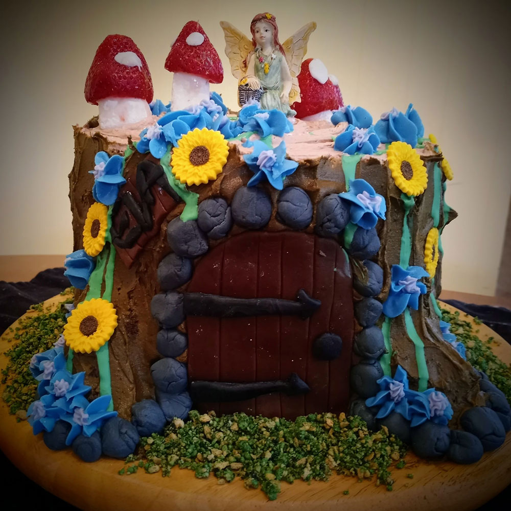 Fairy tale themed cake with flowers