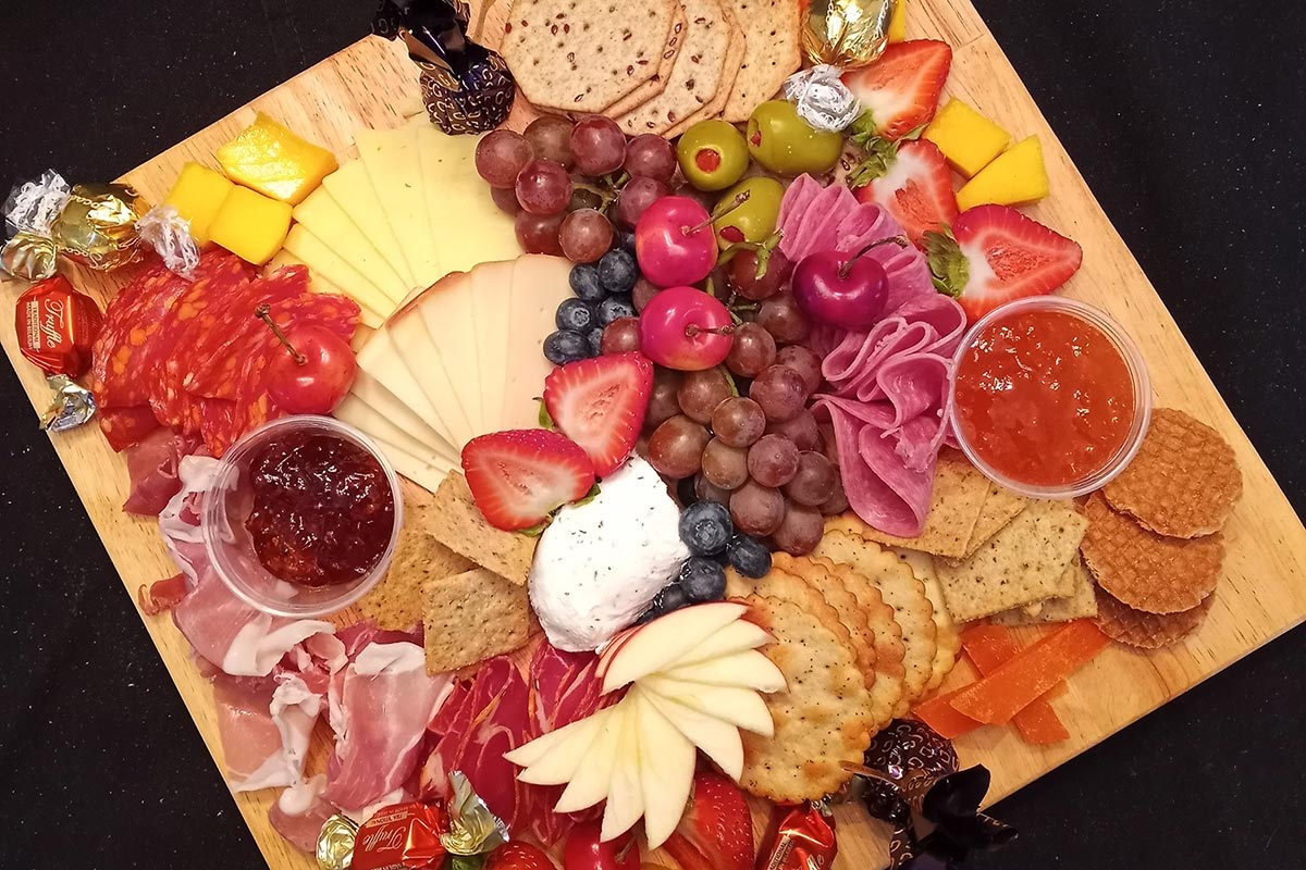 Colorful charcuterie board with fruits