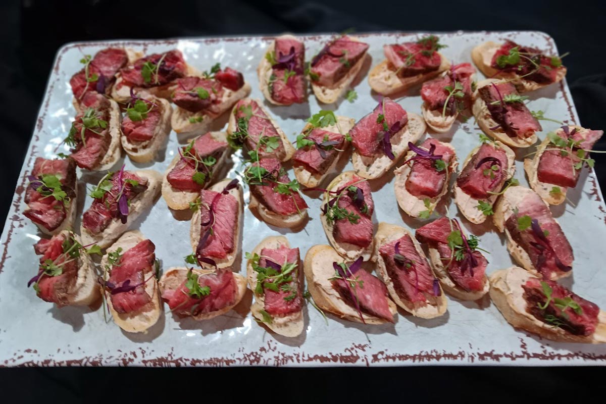 Platter of gourmet beef crostini