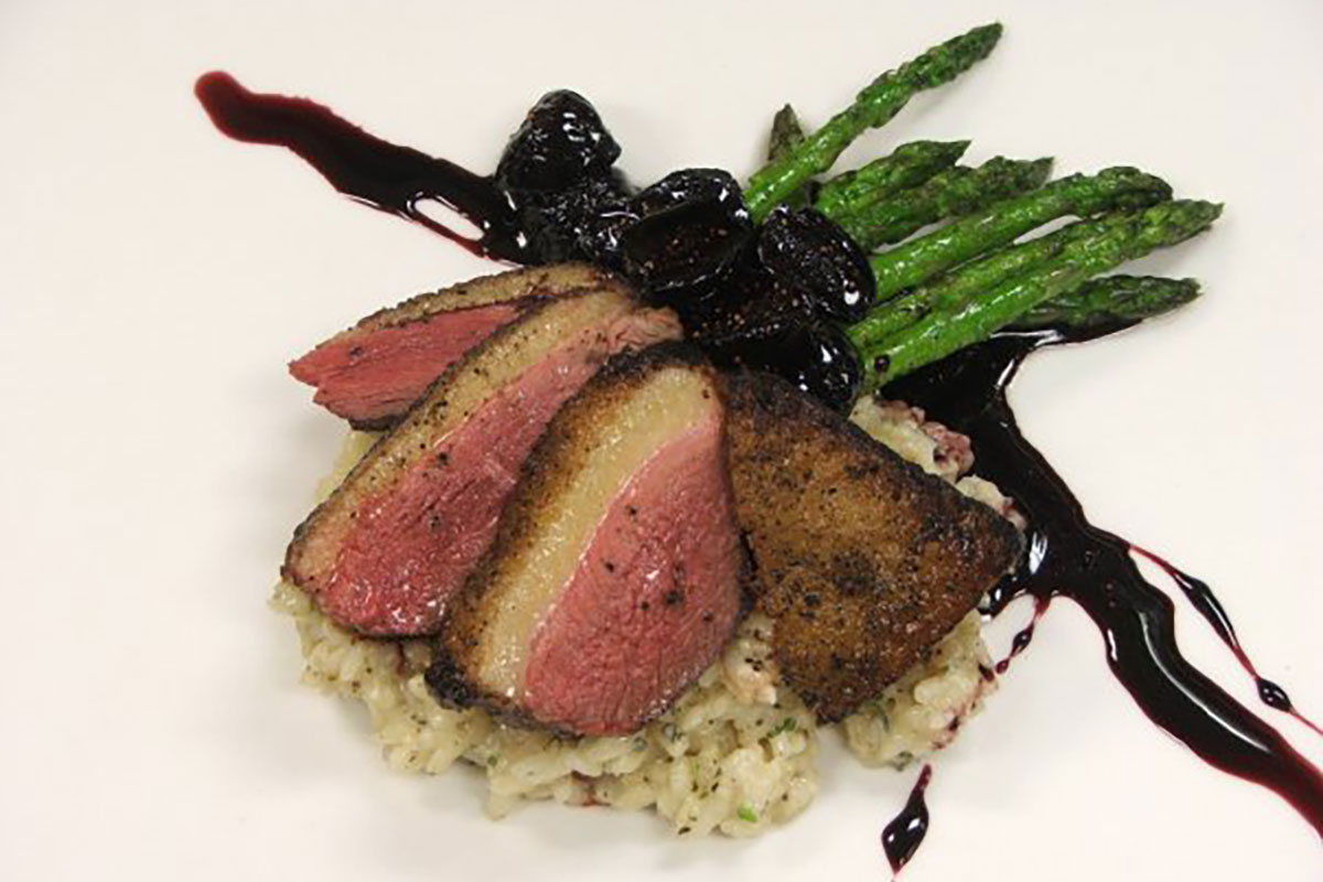 Sliced duck breast with asparagus risotto