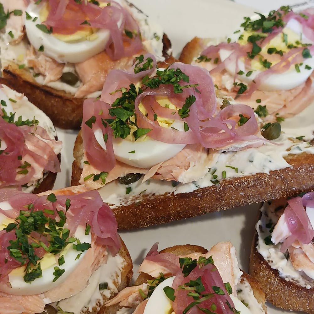 toasted bread topped with salmon and eggs
